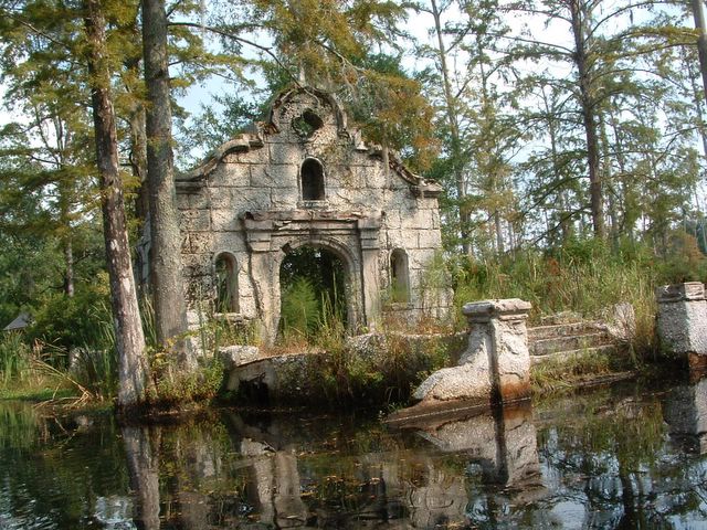 ruins of a building in a cypress swamp.