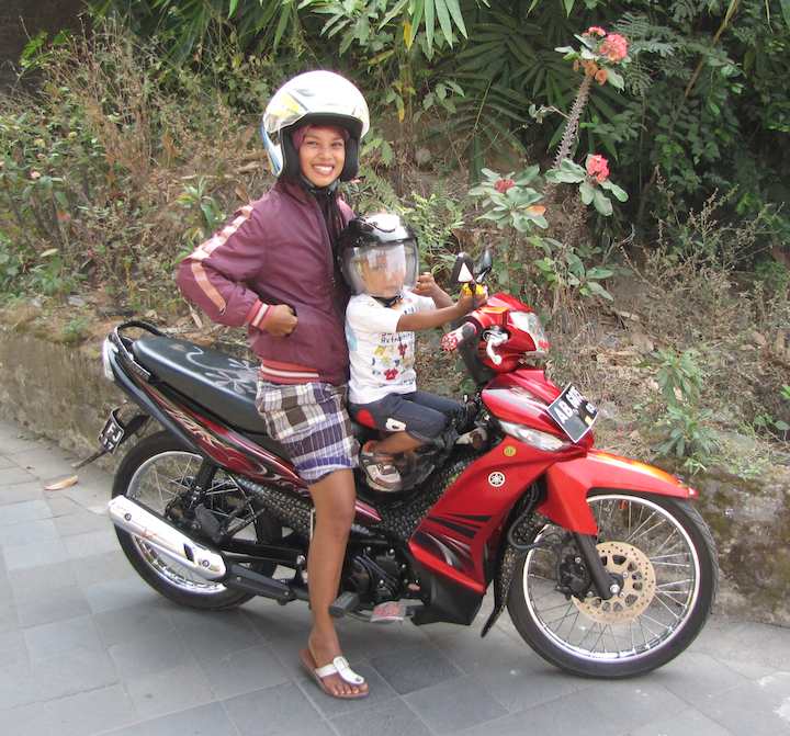 Women with her son on motocycle