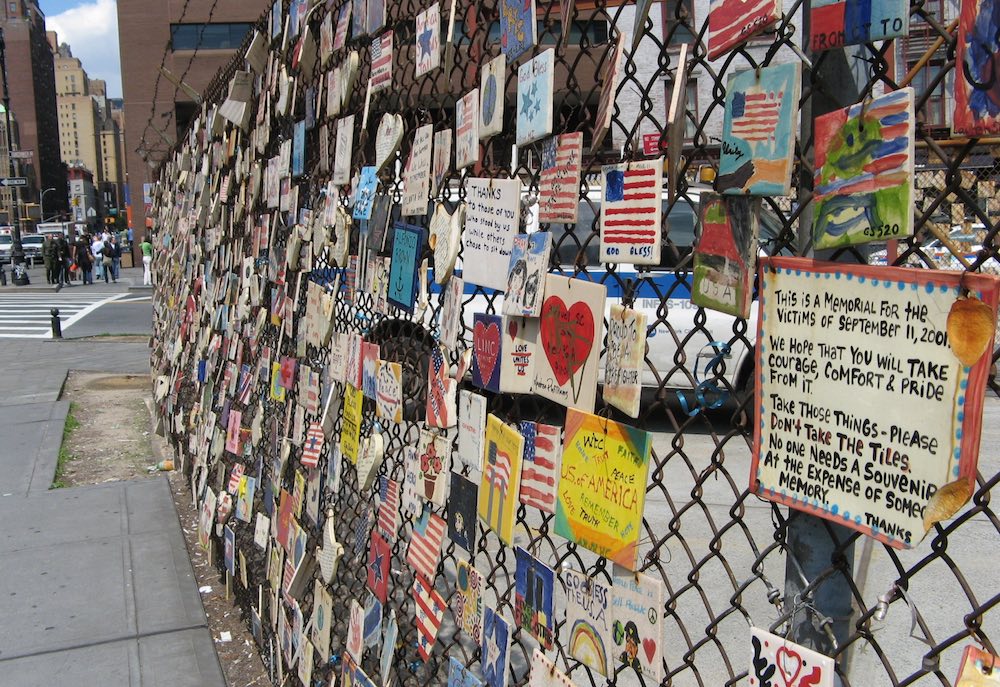 9-11 memorial tiles on a fence