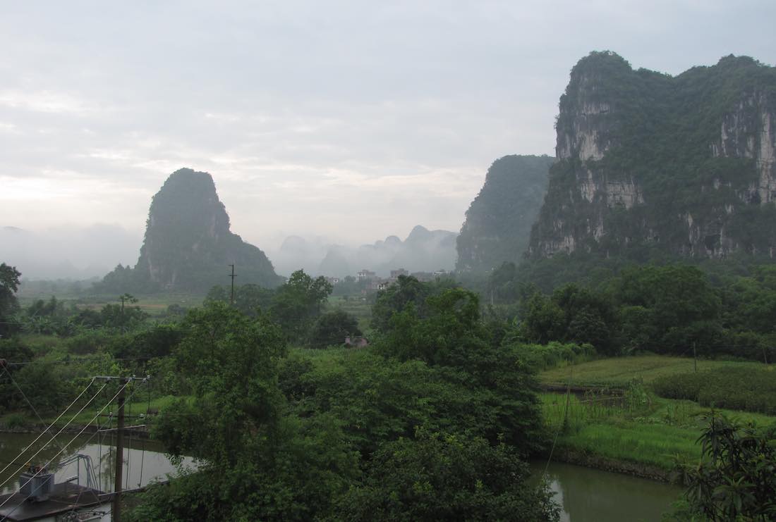 View from hotel with greenery and tower rock landmarks