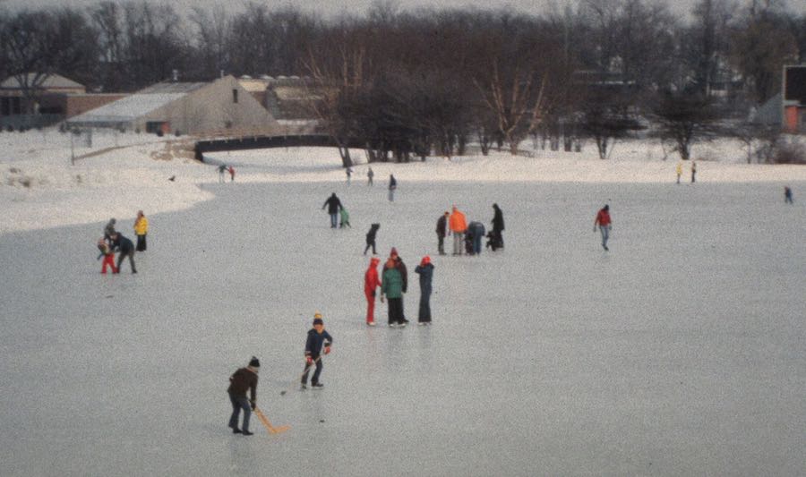 a bunch of people on a frozen waterway