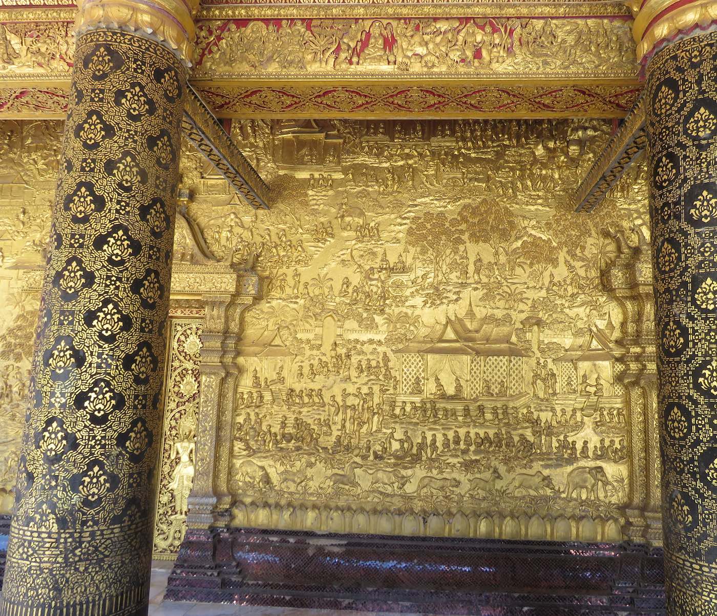 Outside golden wall with relief art
